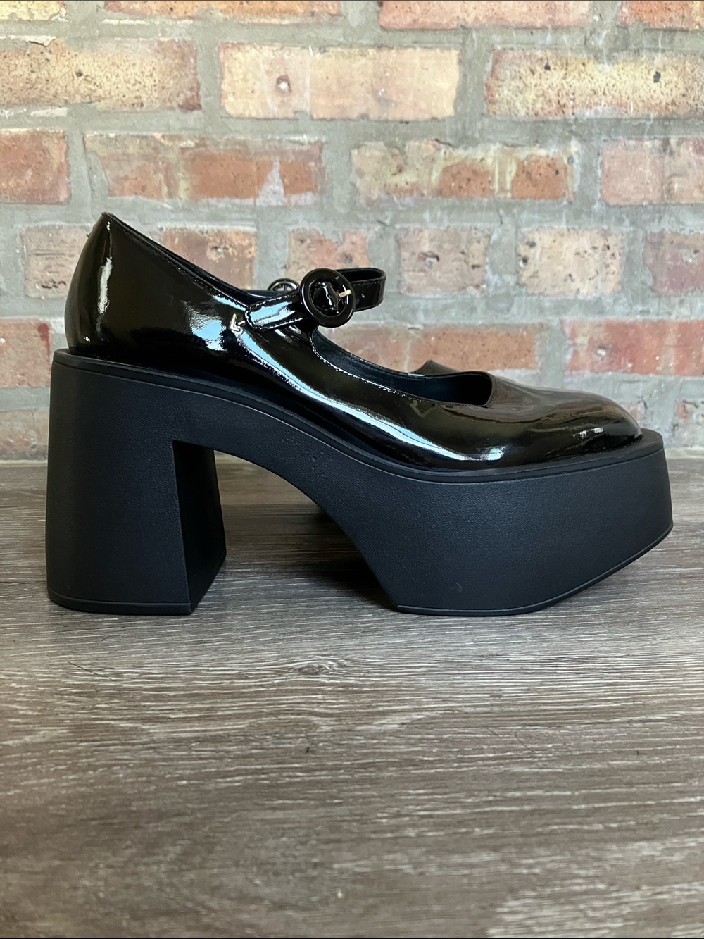 Larroude Olivia Platform Pumps in glossy black patent leather.